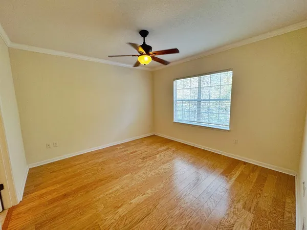 a bathroom with a granite countertop sink a mirror and a bathtub