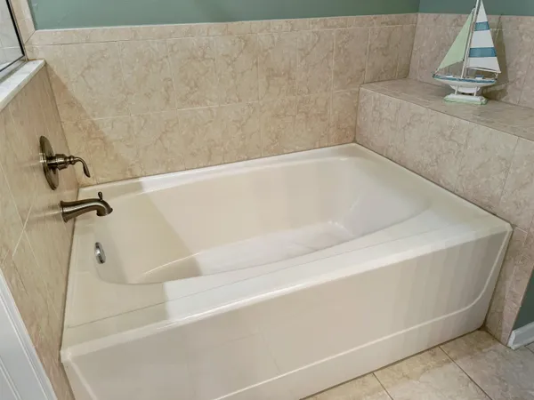 a bathroom with a shower and a tub