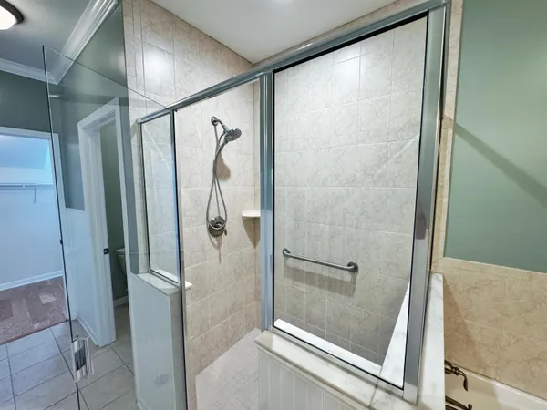 a white toilet sitting next to a sink