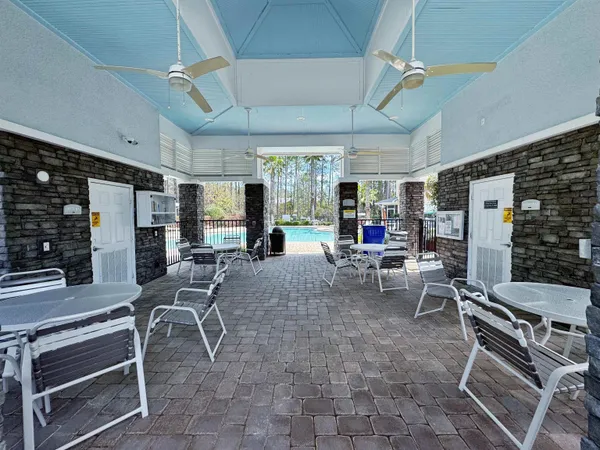 a view of a backyard with sitting area