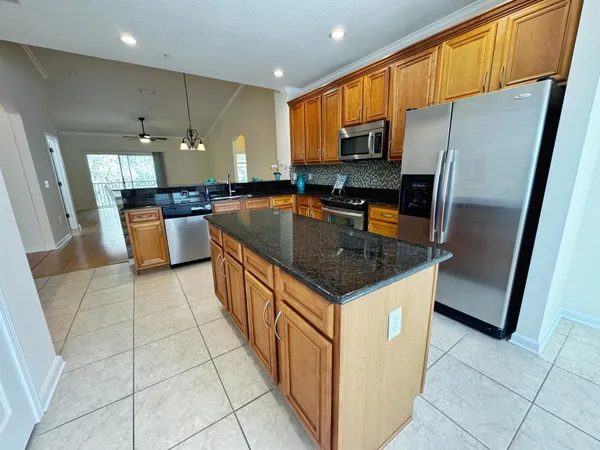 a view of a room with a window and furniture