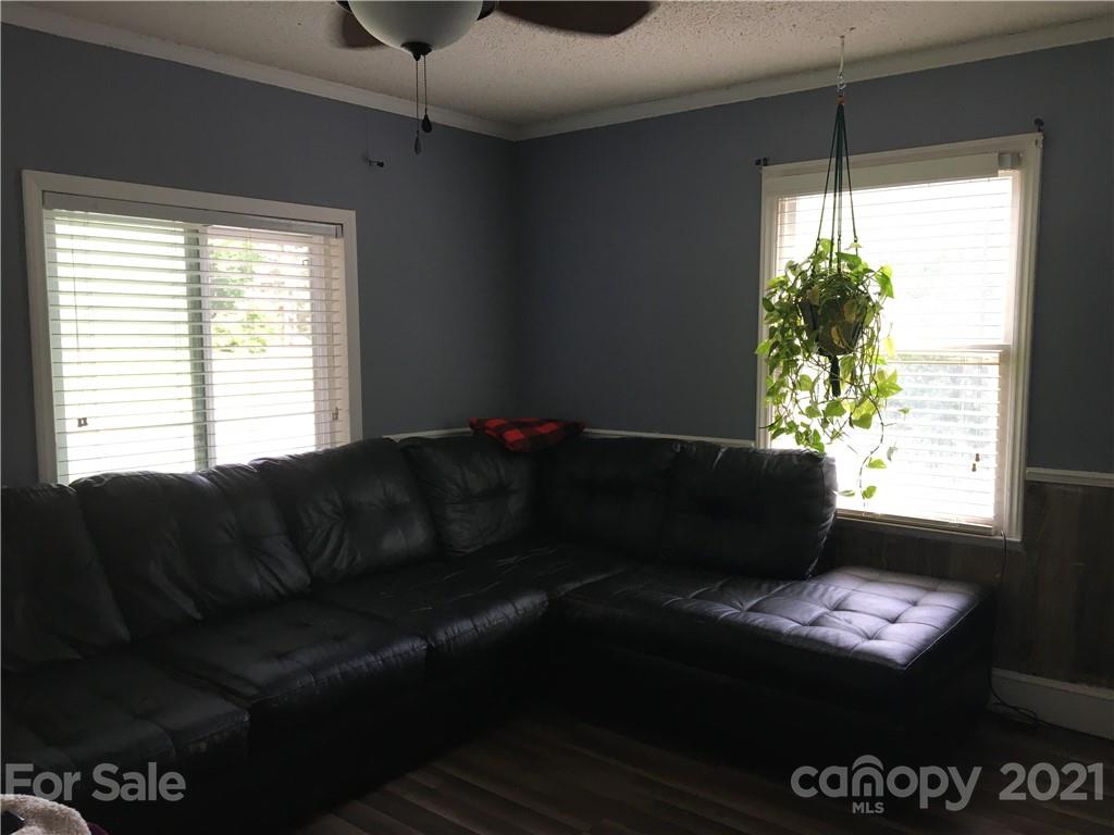 203 North Love Chapel Road Stanfield, NC 28163 - Photo 13 of 19 a living room with furniture and a window
