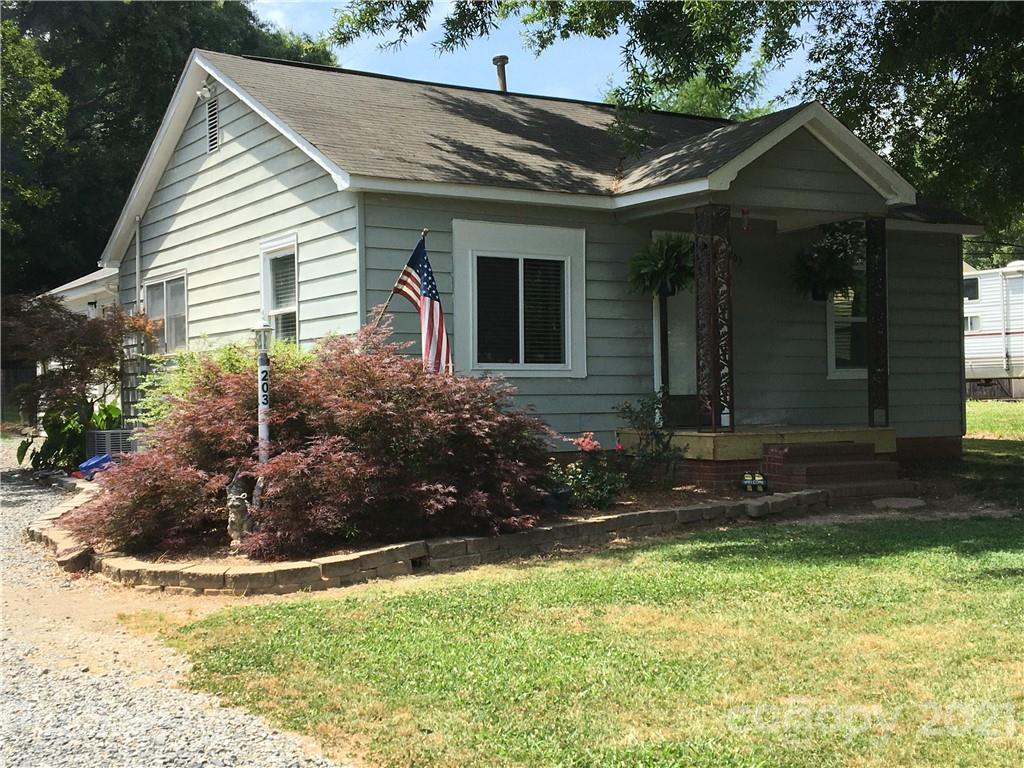203 North Love Chapel Road Stanfield, NC 28163 - Photo 18 of 19 a view of house with backyard and garden