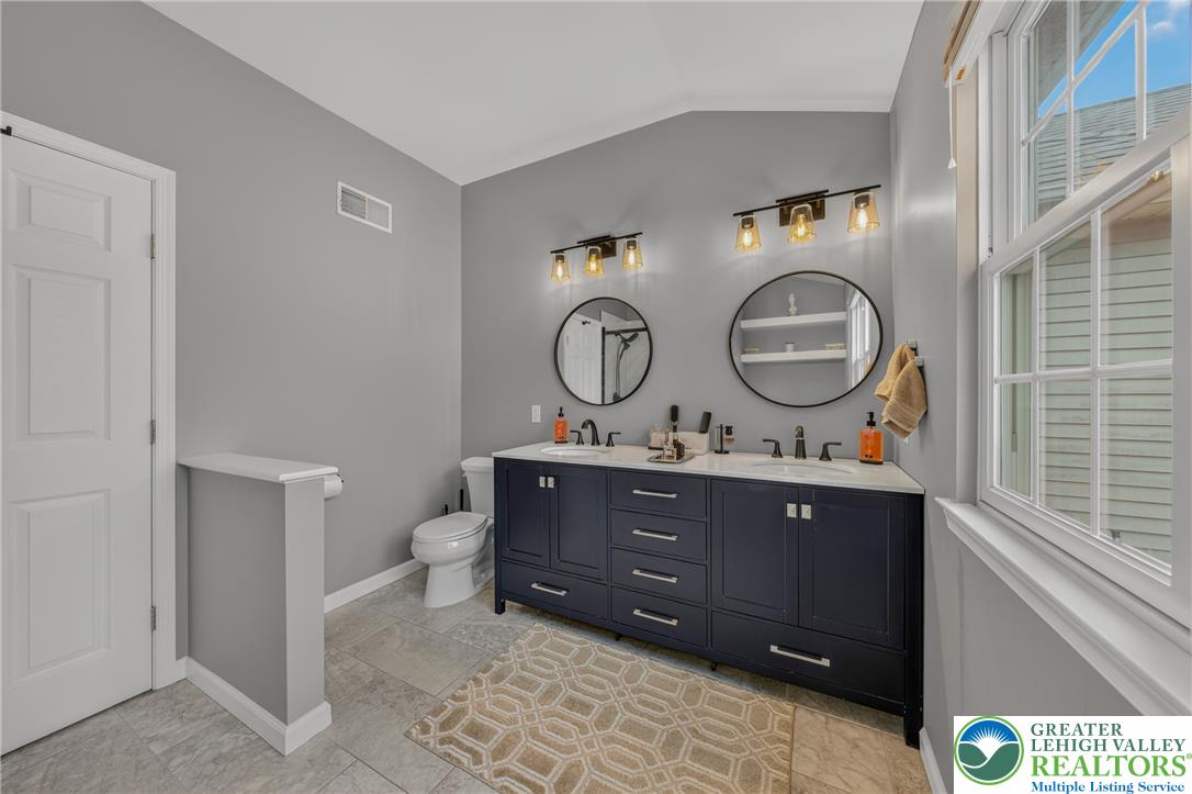 4236 Creek Road Allentown, PA 18104 - Photo 24 of 47 A spacious double vanity and tile flooring highlight this airy bathroom.