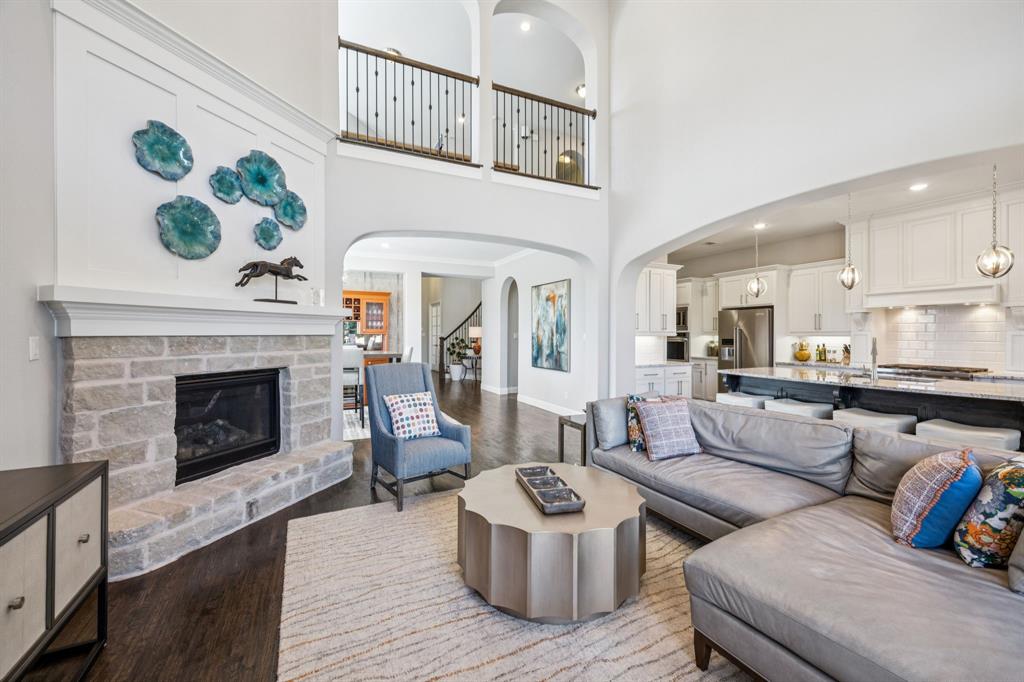 1392 Rolling Thunder Road Frisco, TX 75036 - Photo 13 of 40 a living room with furniture and a fireplace