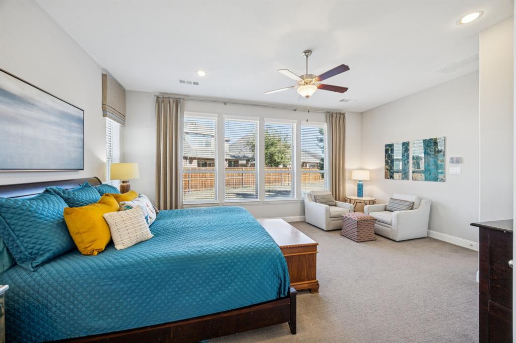 1392 Rolling Thunder Road Frisco, TX 75036 - Photo 21 of 40 a bedroom with a bed and large couches