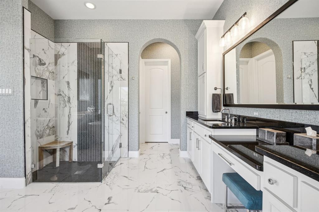 1392 Rolling Thunder Road Frisco, TX 75036 - Photo 23 of 40 a large bathroom with a double vanity sink a mirror and a shower