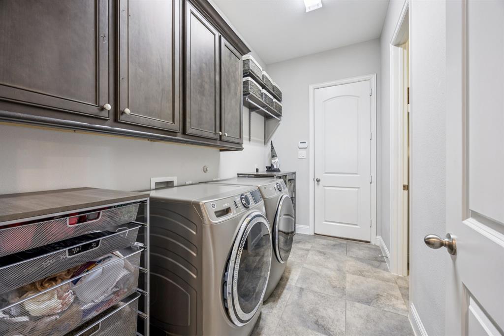 1392 Rolling Thunder Road Frisco, TX 75036 - Photo 25 of 40 a utility room with dryer and washer