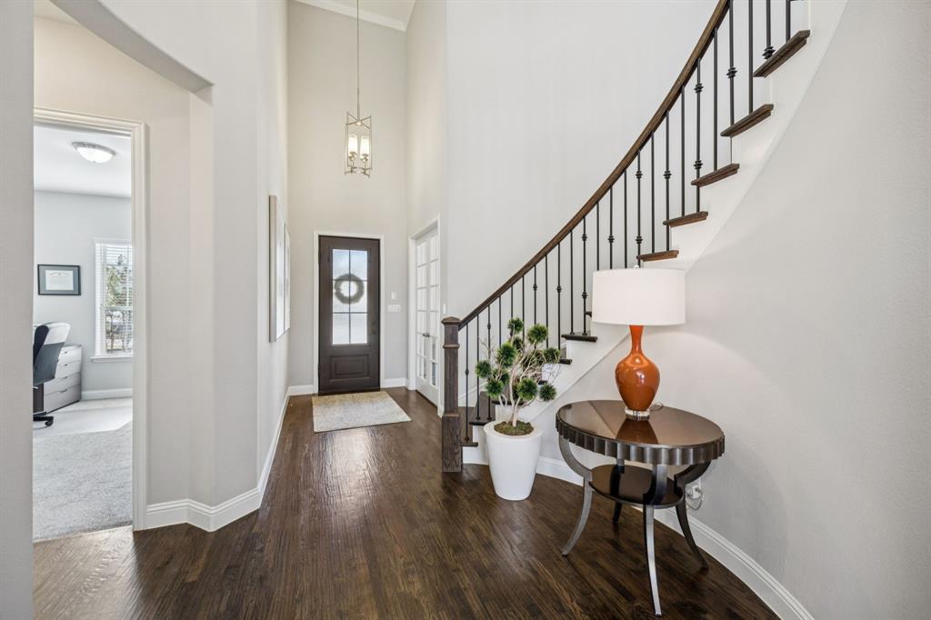 1392 Rolling Thunder Road Frisco, TX 75036 - Photo 3 of 40 a view of entryway and hall with wooden floor