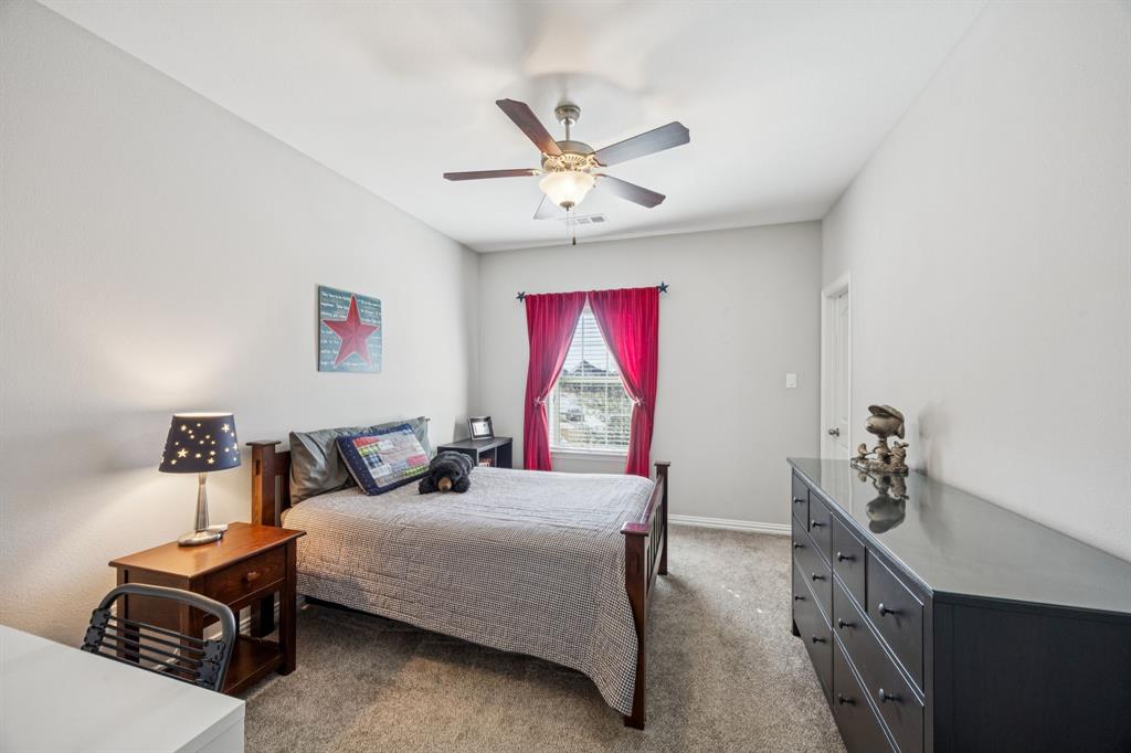 1392 Rolling Thunder Road Frisco, TX 75036 - Photo 33 of 40 a bedroom with furniture and a window