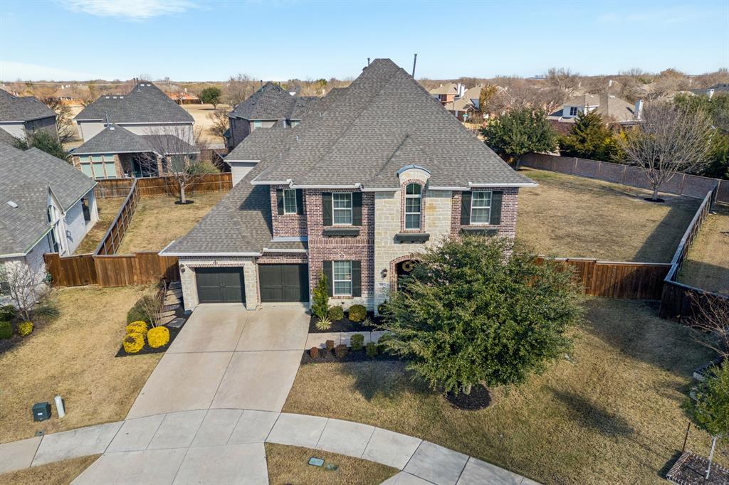 1392 Rolling Thunder Road Frisco, TX 75036 - Photo 35 of 40 an aerial view of a house with a yard
