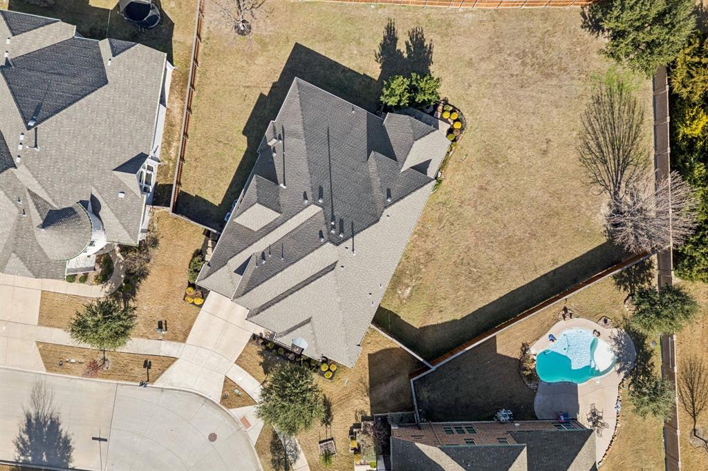 1392 Rolling Thunder Road Frisco, TX 75036 - Photo 36 of 40 an aerial view of a house with a yard