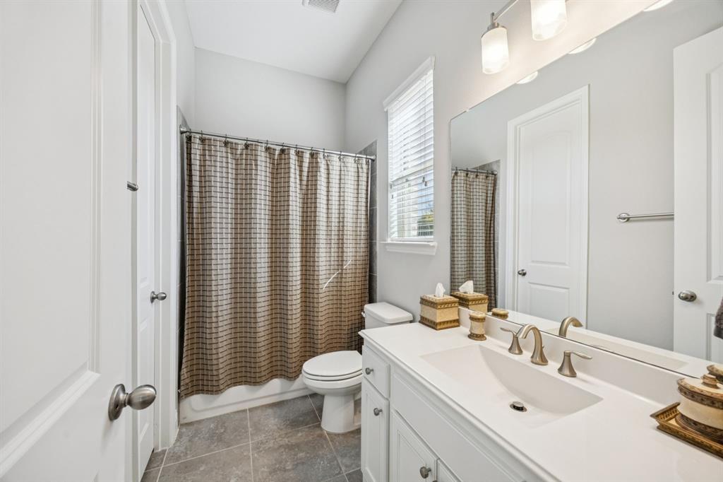 1392 Rolling Thunder Road Frisco, TX 75036 - Photo 6 of 40 a bathroom with a sink toilet and shower