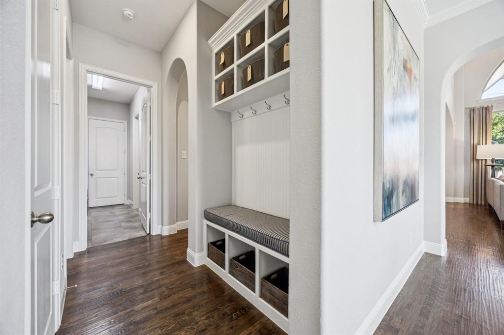 1392 Rolling Thunder Road Frisco, TX 75036 - Photo 7 of 40 a view of a hallway with wooden floor and staircase