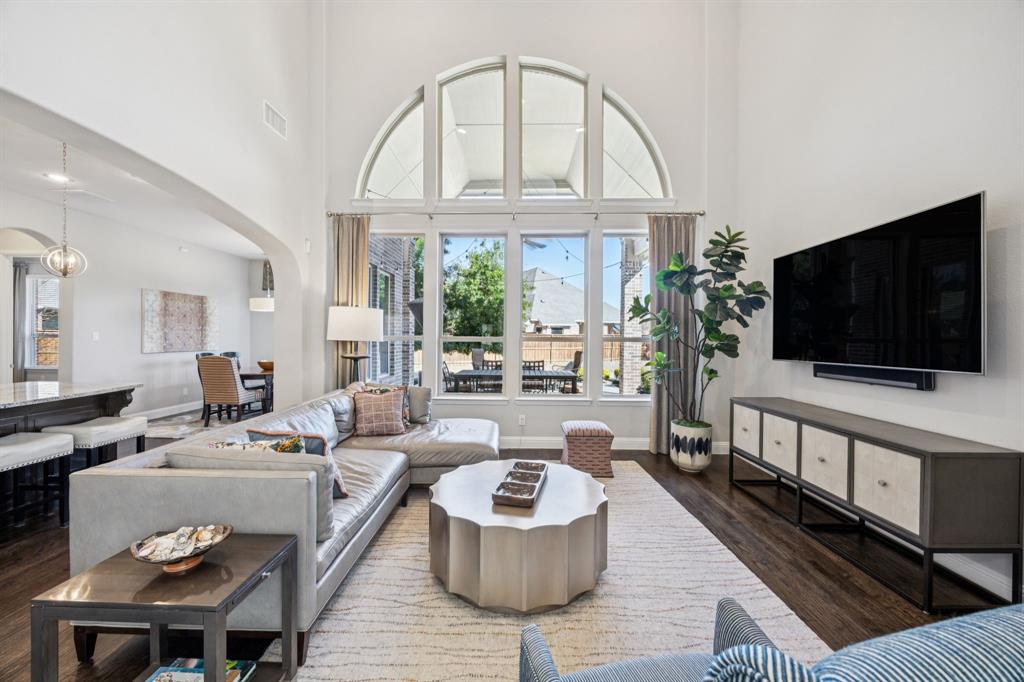 1392 Rolling Thunder Road Frisco, TX 75036 - Photo 10 of 40 a living room with furniture and a flat screen tv
