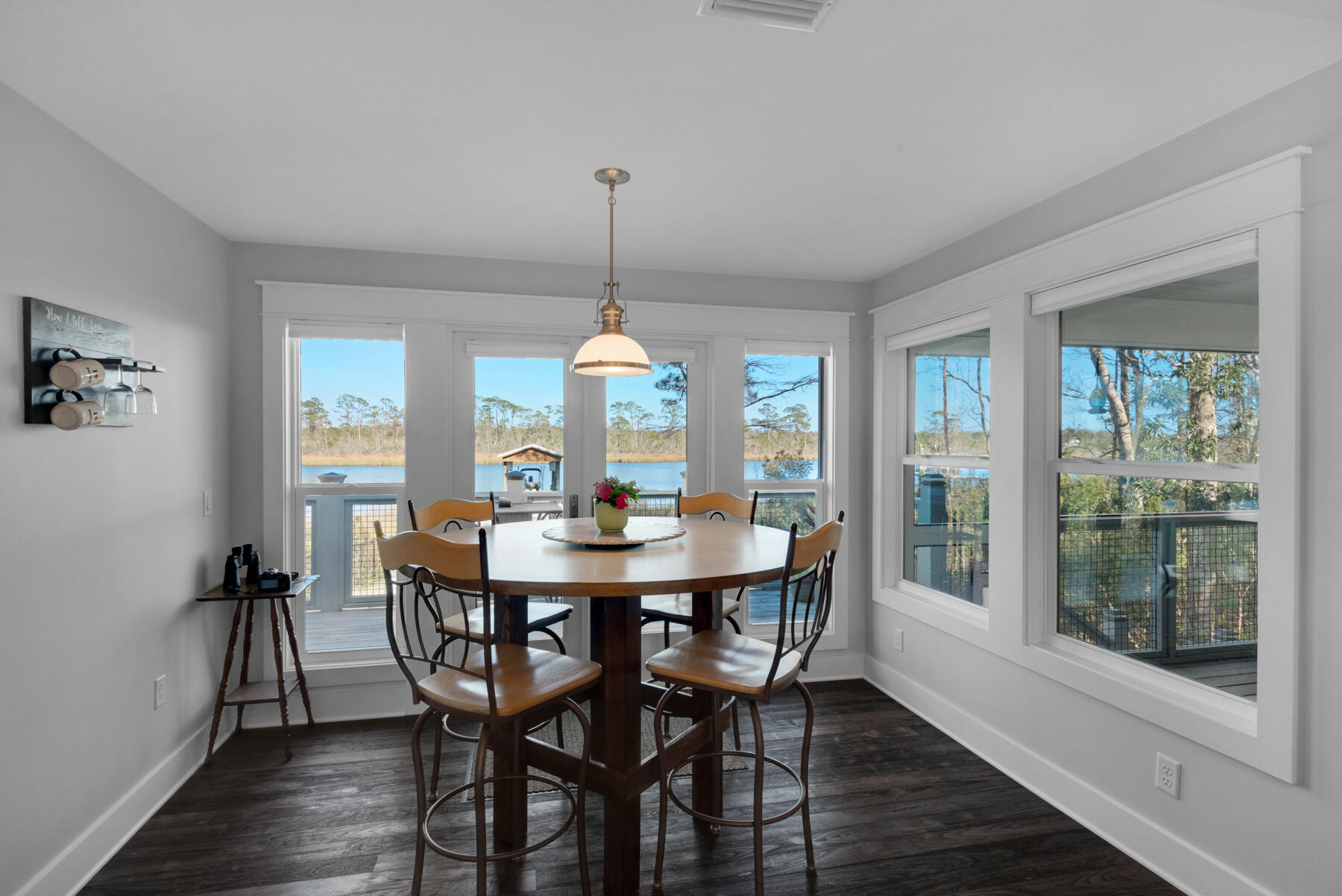 515 Whitfield Road Freeport, FL 32439 - Photo 12 of 39 a view of a dining room with furniture window and wooden floor