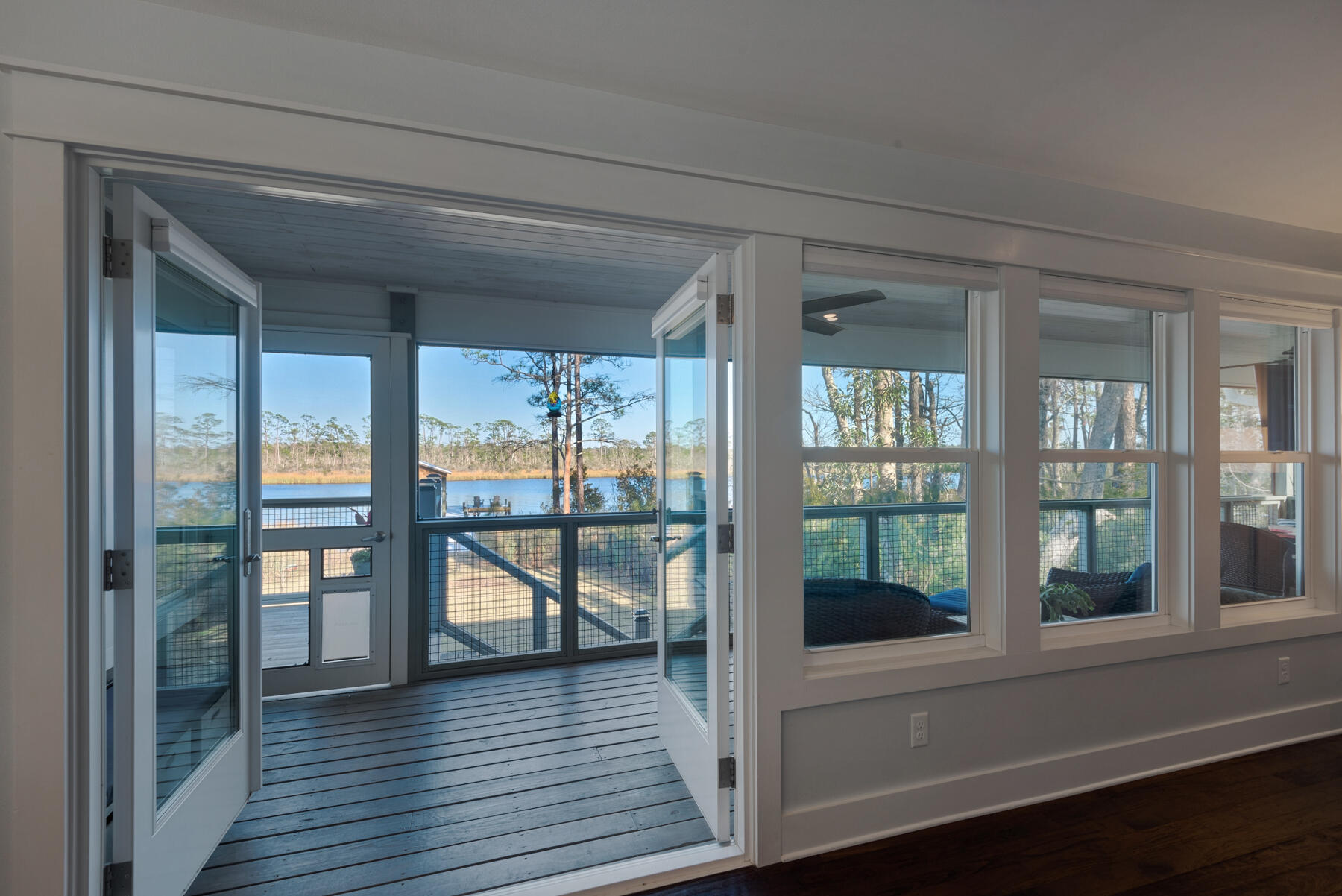 515 Whitfield Road Freeport, FL 32439 - Photo 14 of 39 a view of a room with wooden floor and windows