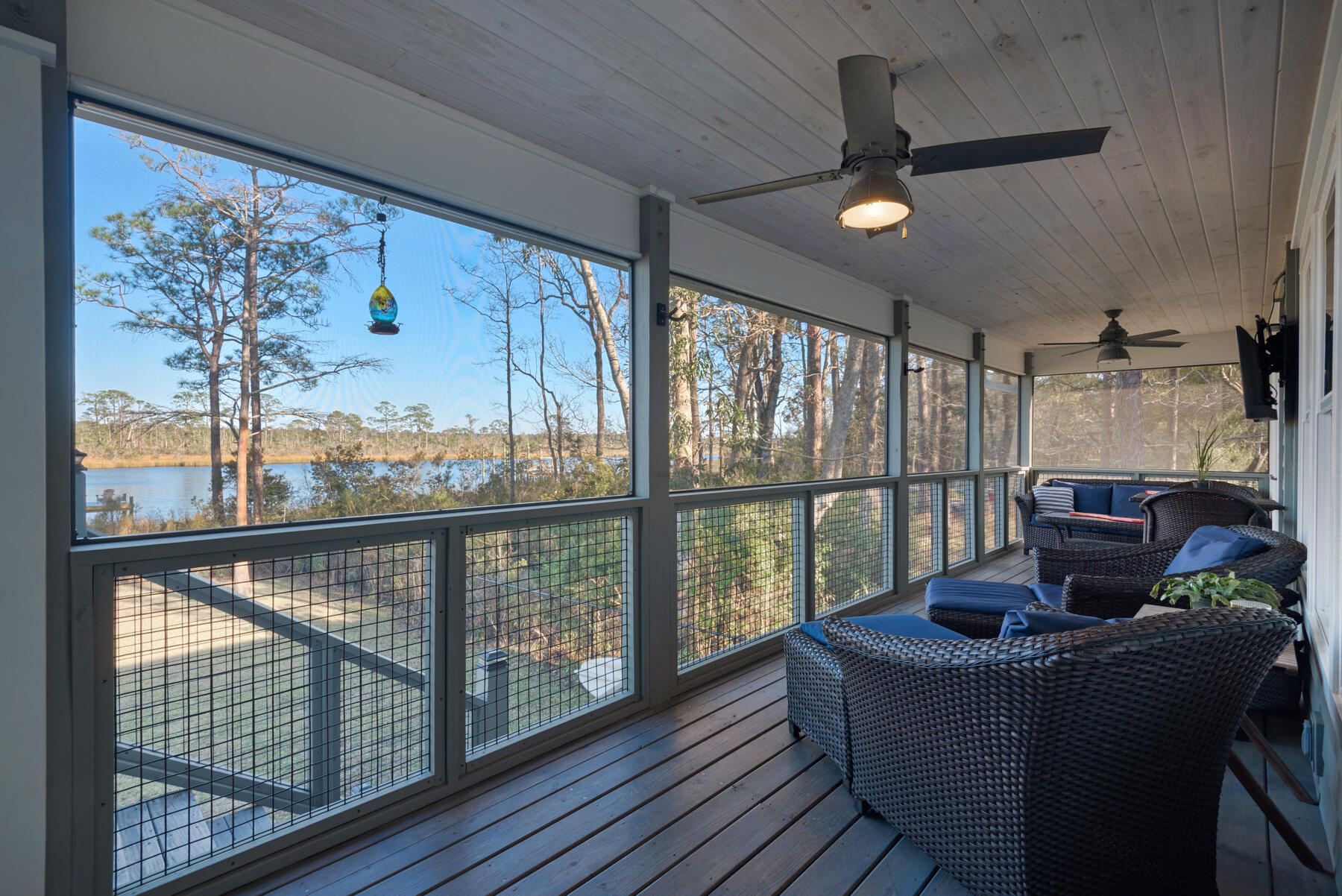 515 Whitfield Road Freeport, FL 32439 - Photo 15 of 39 a living room with furniture tv and a window