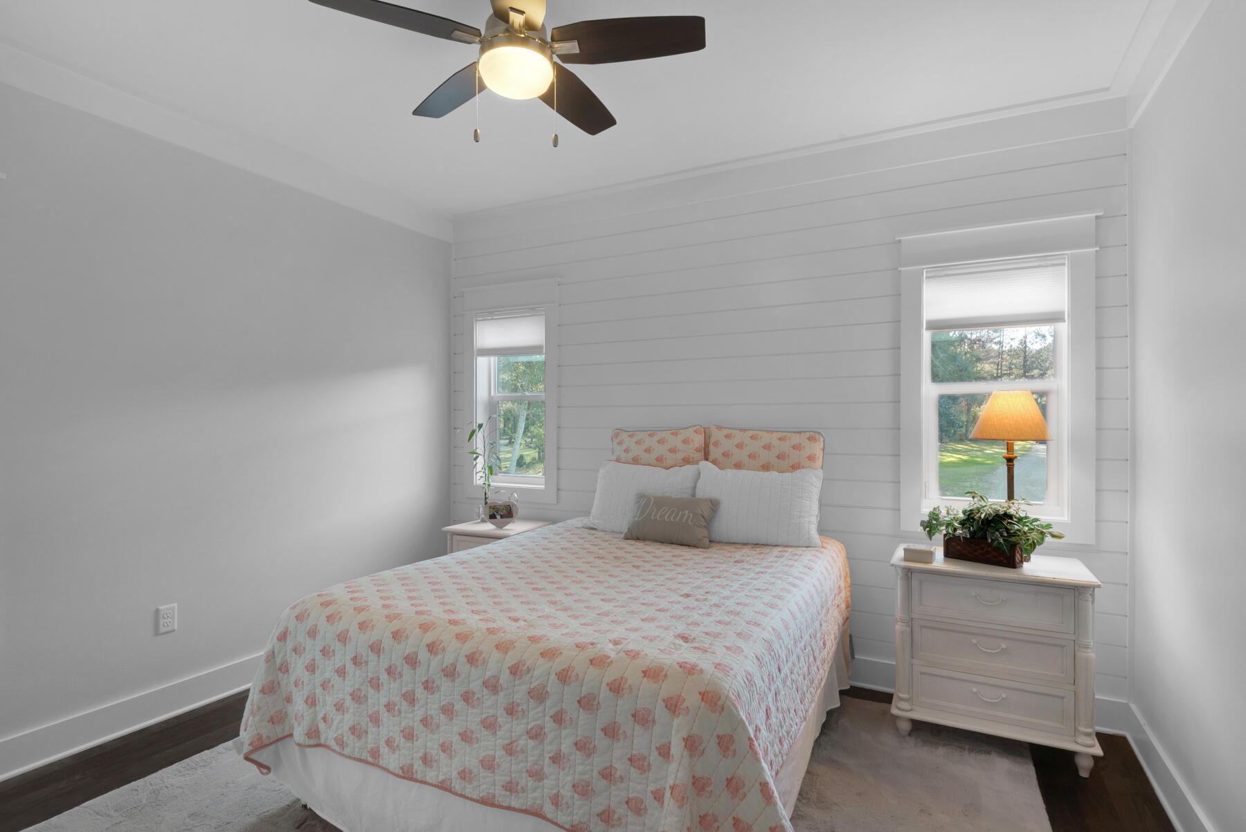 515 Whitfield Road Freeport, FL 32439 - Photo 25 of 39 a bedroom with a bed and a potted plant