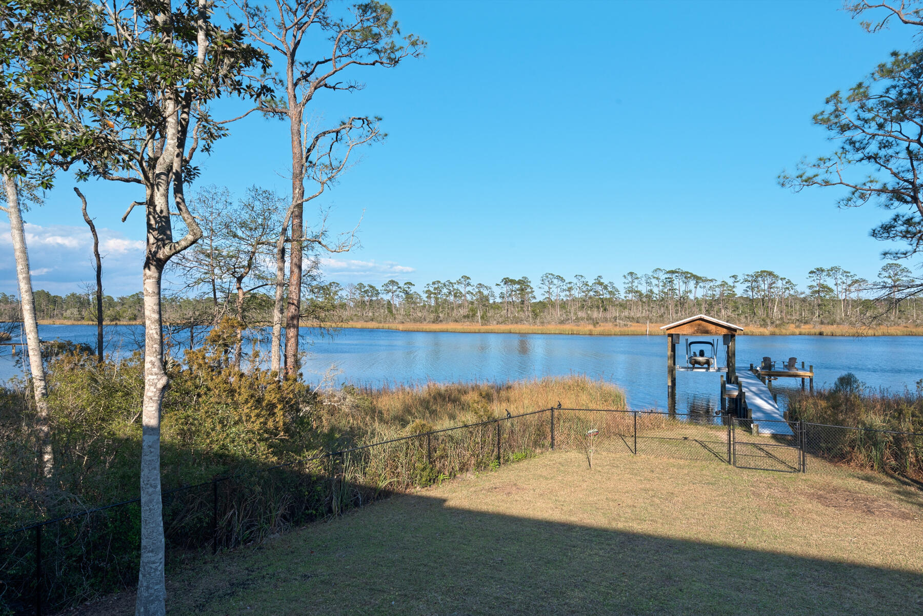 515 Whitfield Road Freeport, FL 32439 - Photo 28 of 39 a view of a lake with a beach