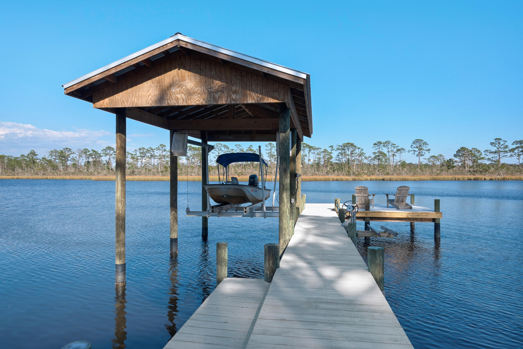 515 Whitfield Road Freeport, FL 32439 - Photo 29 of 39 a view of a swimming pool with lounge chairs
