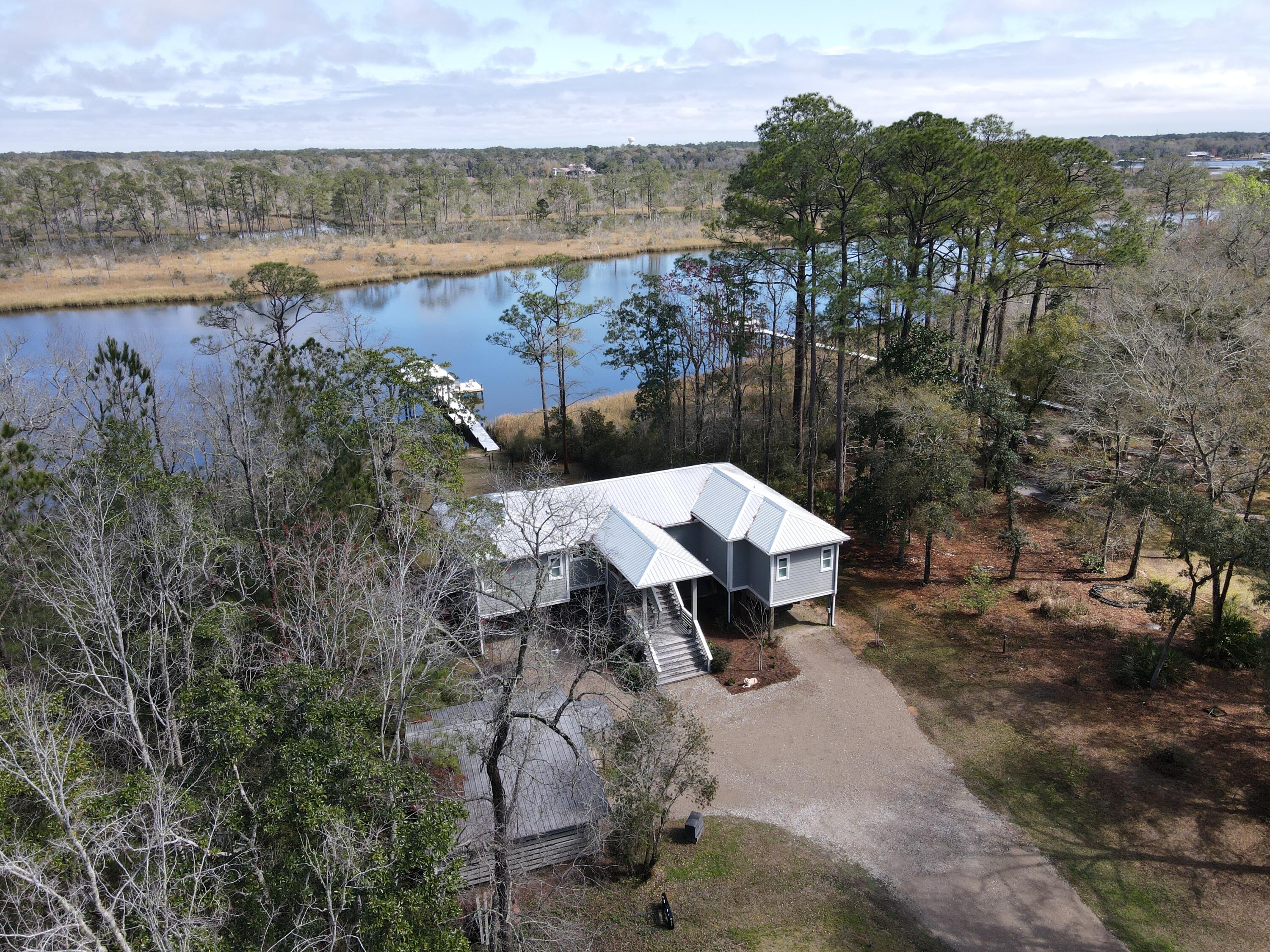 515 Whitfield Road Freeport, FL 32439 - Photo 3 of 39 a view of a lake in middle of the town