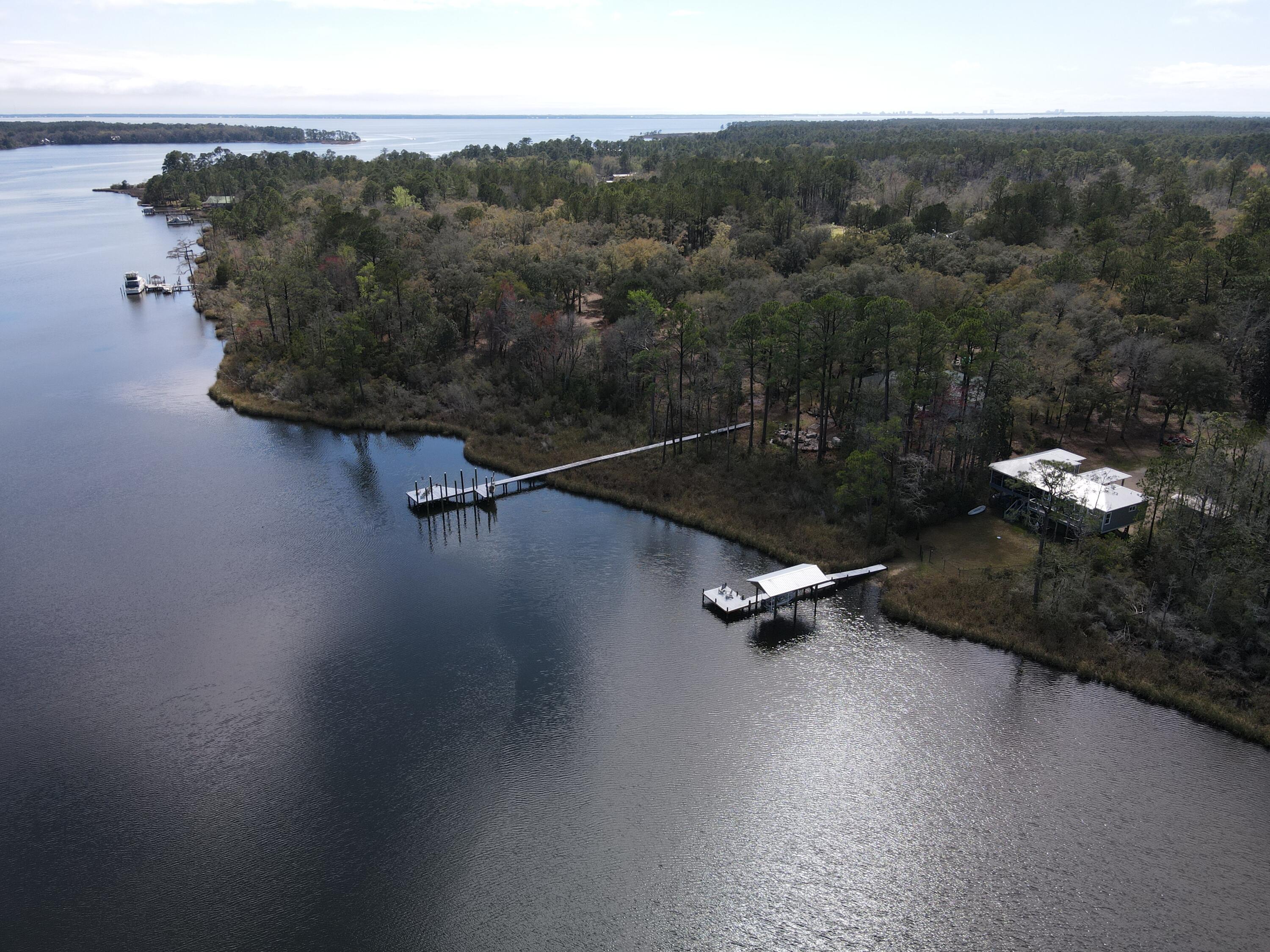 515 Whitfield Road Freeport, FL 32439 - Photo 5 of 39 an aerial view of a mountain with a yard
