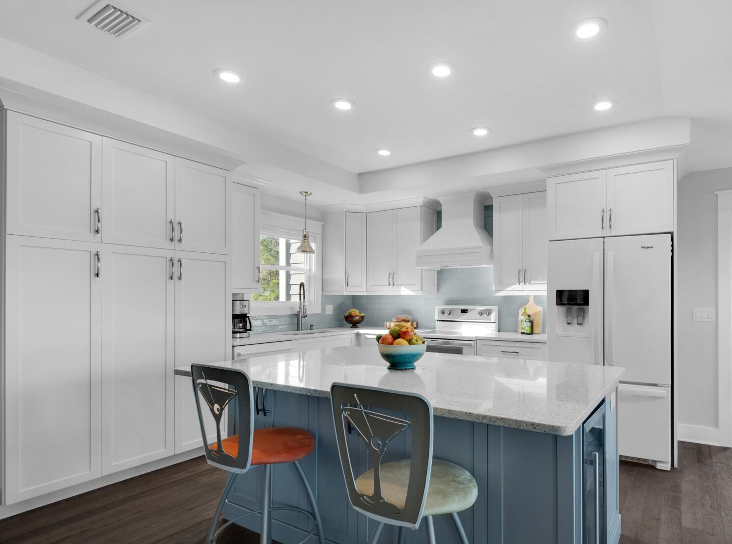 515 Whitfield Road Freeport, FL 32439 - Photo 8 of 39 a kitchen with a sink a stove a refrigerator cabinets and wooden floor