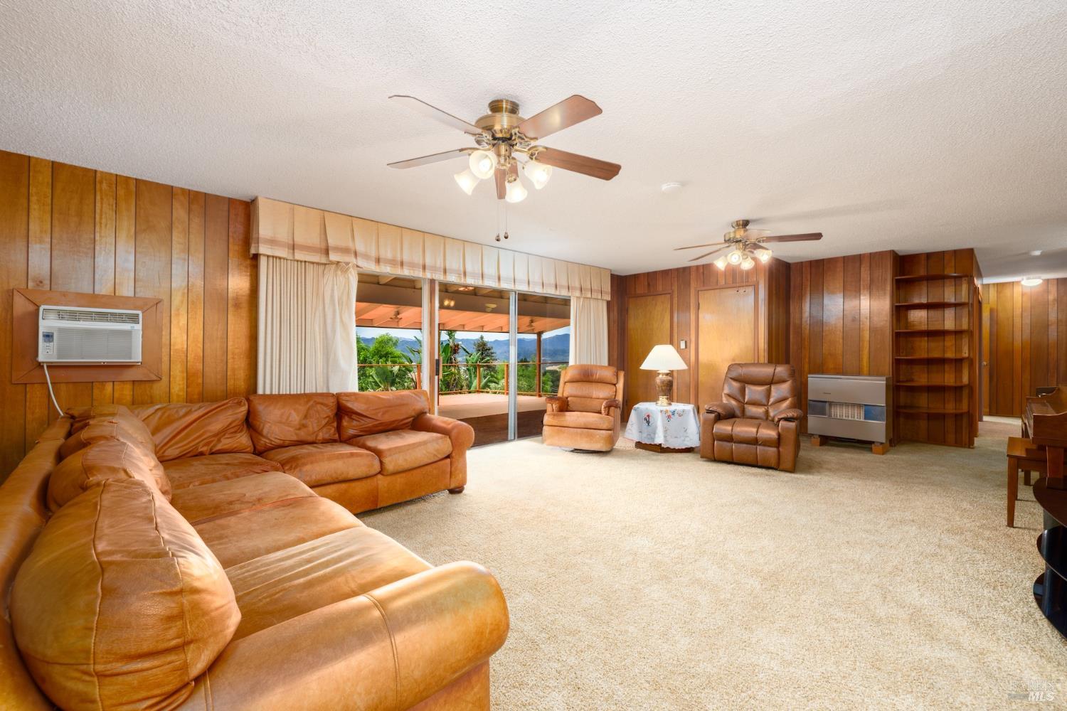 1135 Palomino Road Cloverdale, CA 95425 - Photo 11 of 42 a living room with furniture and a large window