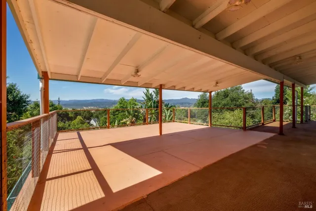 a view of porch with a floor to ceiling window and a floor to ceiling window