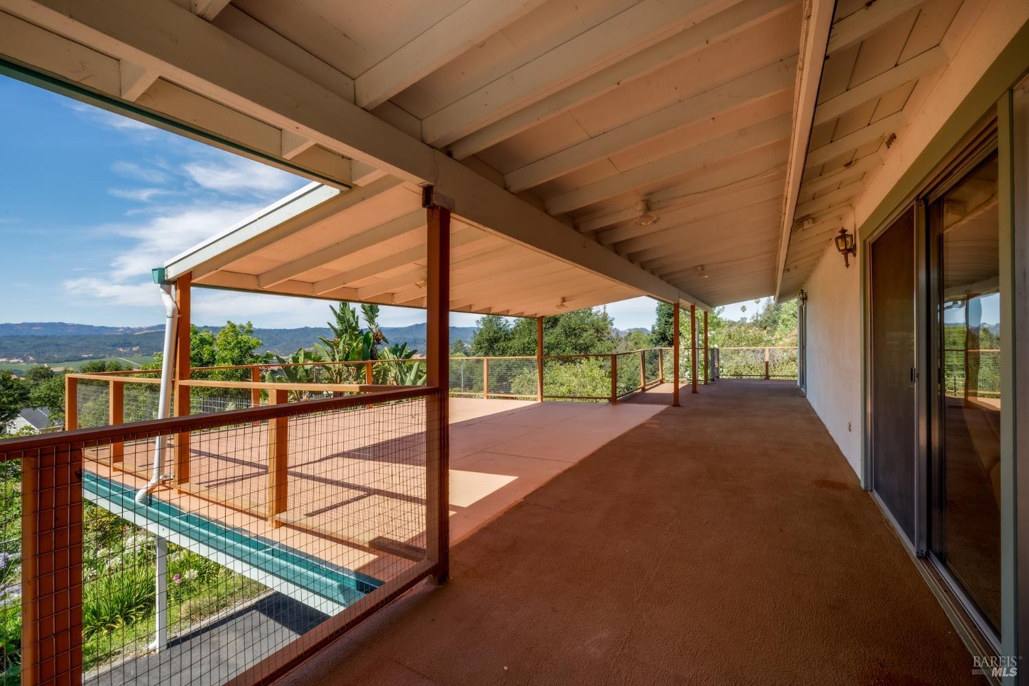 1135 Palomino Road Cloverdale, CA 95425 - Photo 14 of 42 a view of porch with a floor to ceiling window and a floor to ceiling window