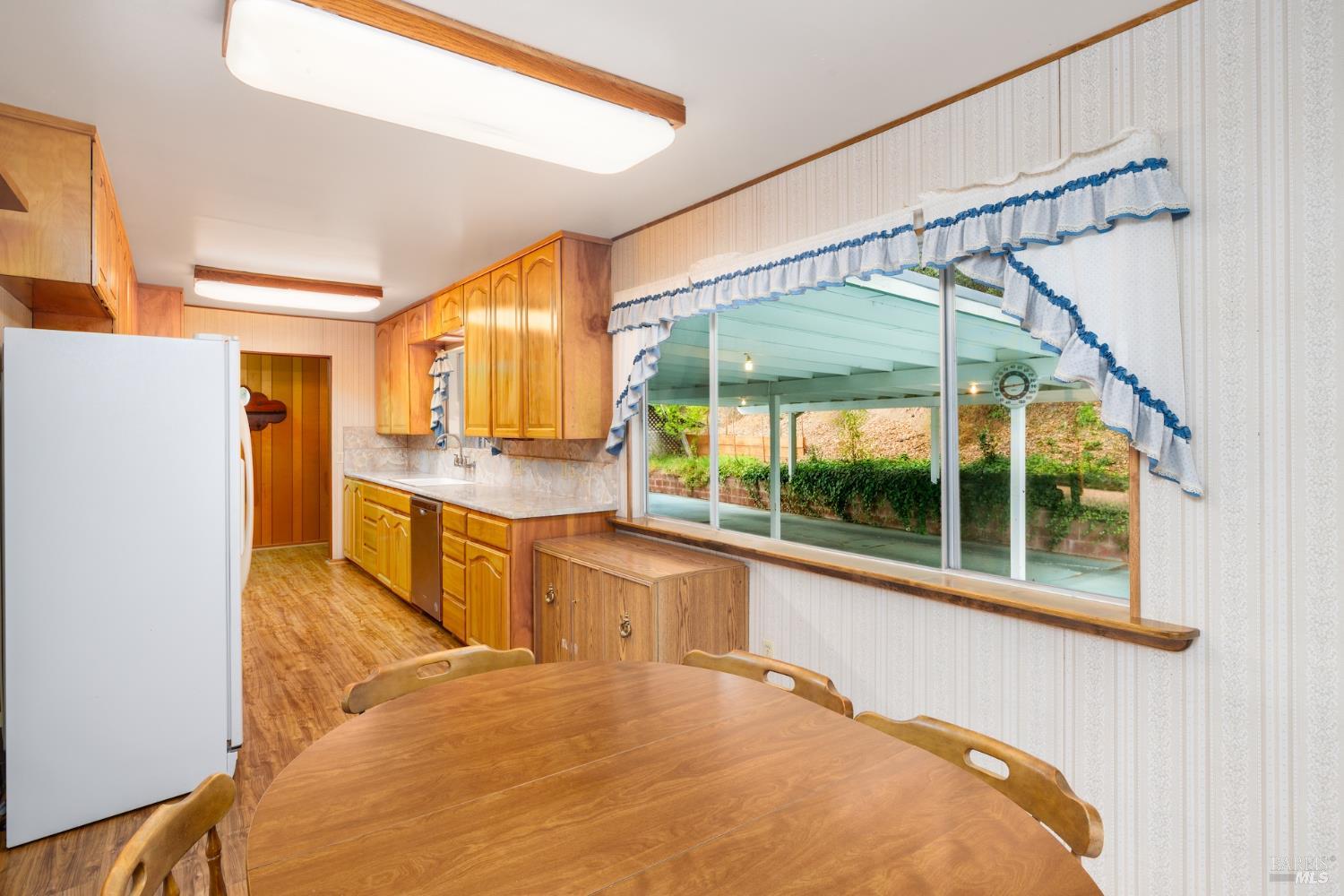 1135 Palomino Road Cloverdale, CA 95425 - Photo 17 of 42 a large white kitchen with a large window