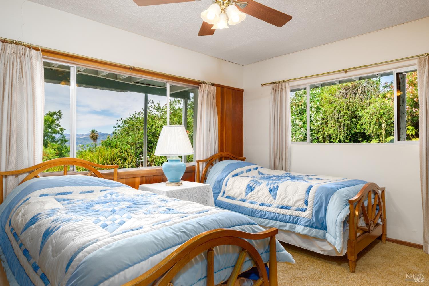 1135 Palomino Road Cloverdale, CA 95425 - Photo 27 of 42 a bedroom with a bed and a large window