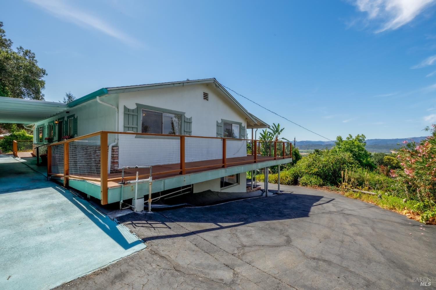 1135 Palomino Road Cloverdale, CA 95425 - Photo 9 of 42 a view of a house with a yard