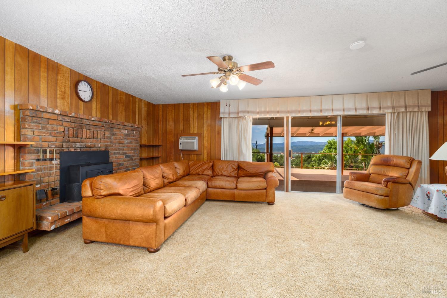 1135 Palomino Road Cloverdale, CA 95425 - Photo 10 of 42 a living room with furniture and a fireplace