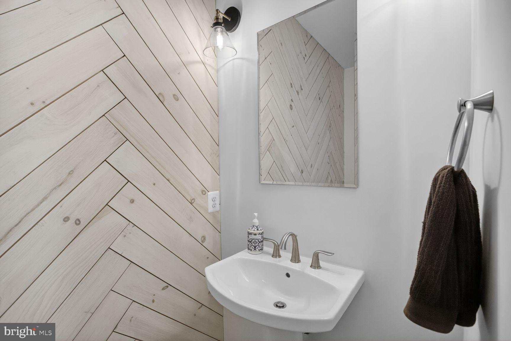 5613 Namakagan Road Bethesda, MD 20816 - Photo 24 of 58 Custom powder room with accent wall