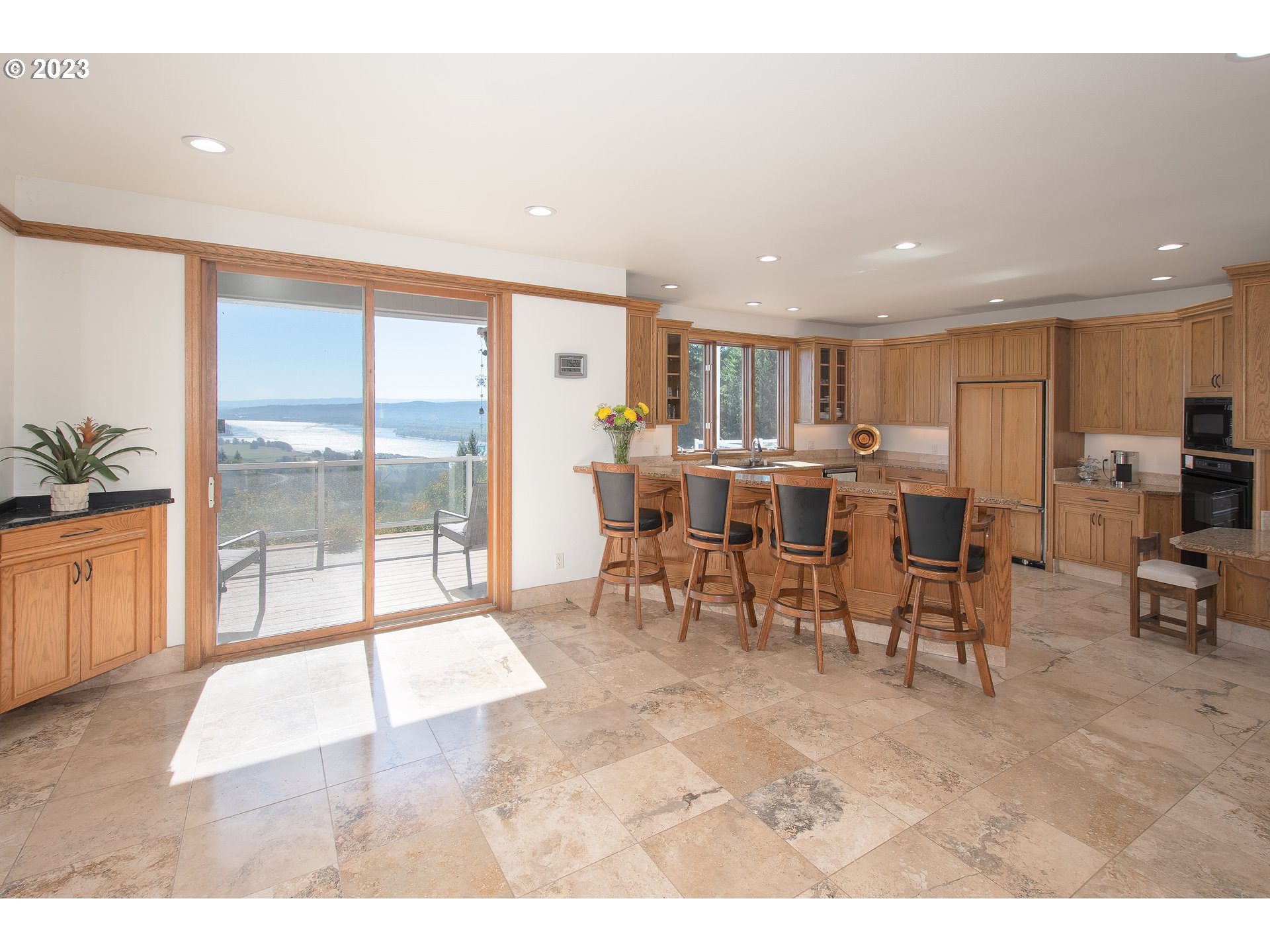 206 Pebble Lane Kalama, WA 98625 - Photo 14 of 47 a living room with stainless steel appliances kitchen island granite countertop furniture and a large window
