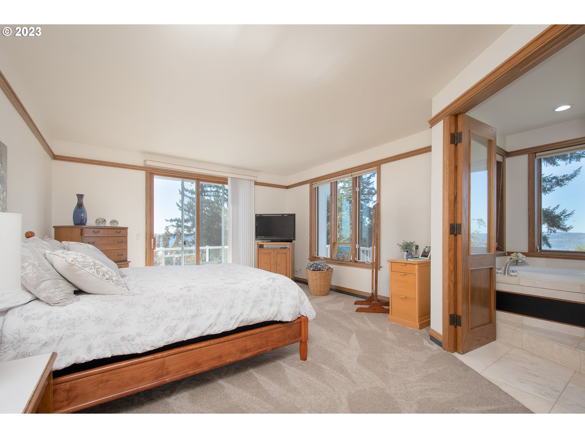 206 Pebble Lane Kalama, WA 98625 - Photo 19 of 47 a bedroom with a large bed and a large window