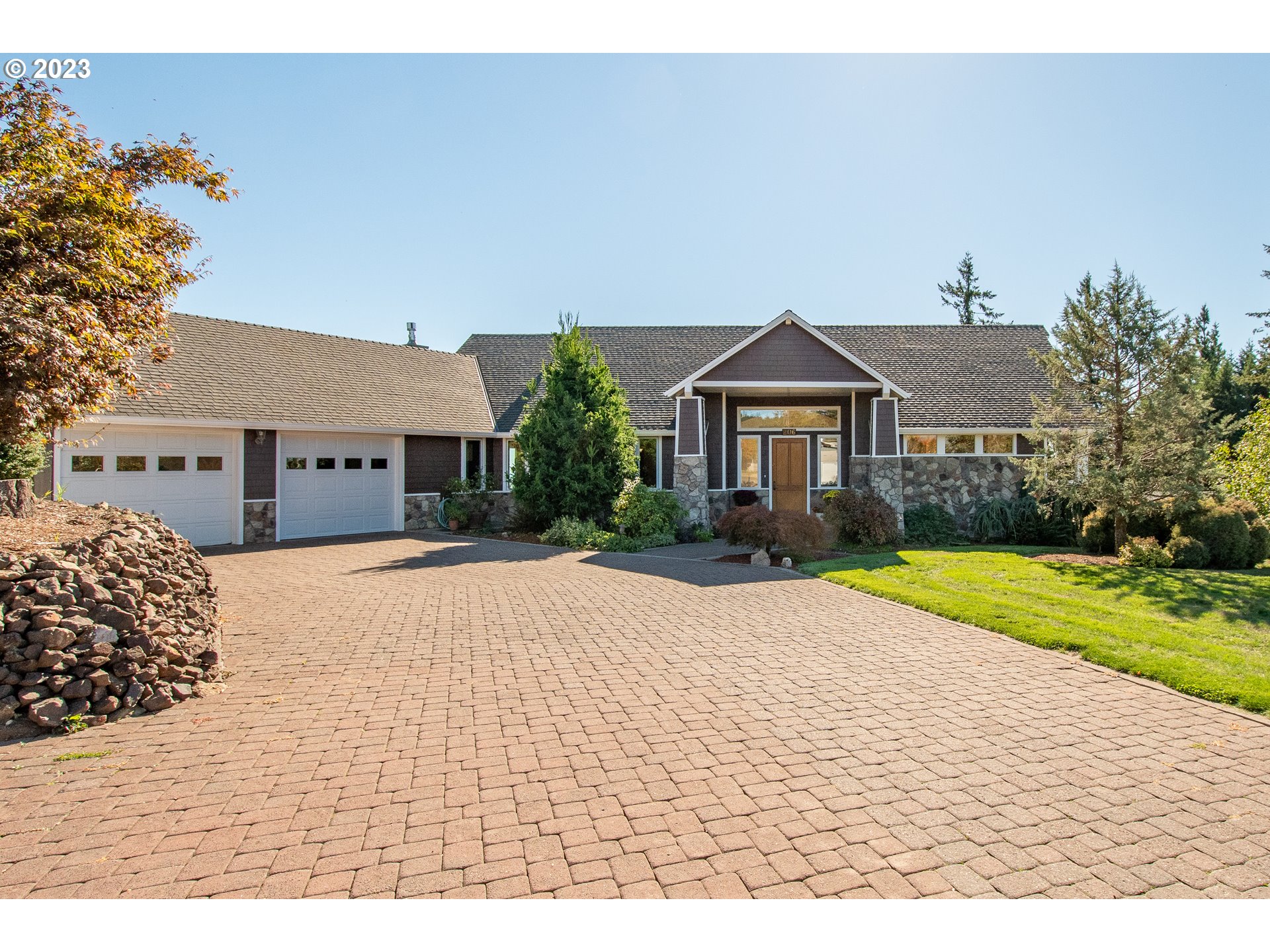 206 Pebble Lane Kalama, WA 98625 - Photo 2 of 47 a front view of a house with a yard and garage