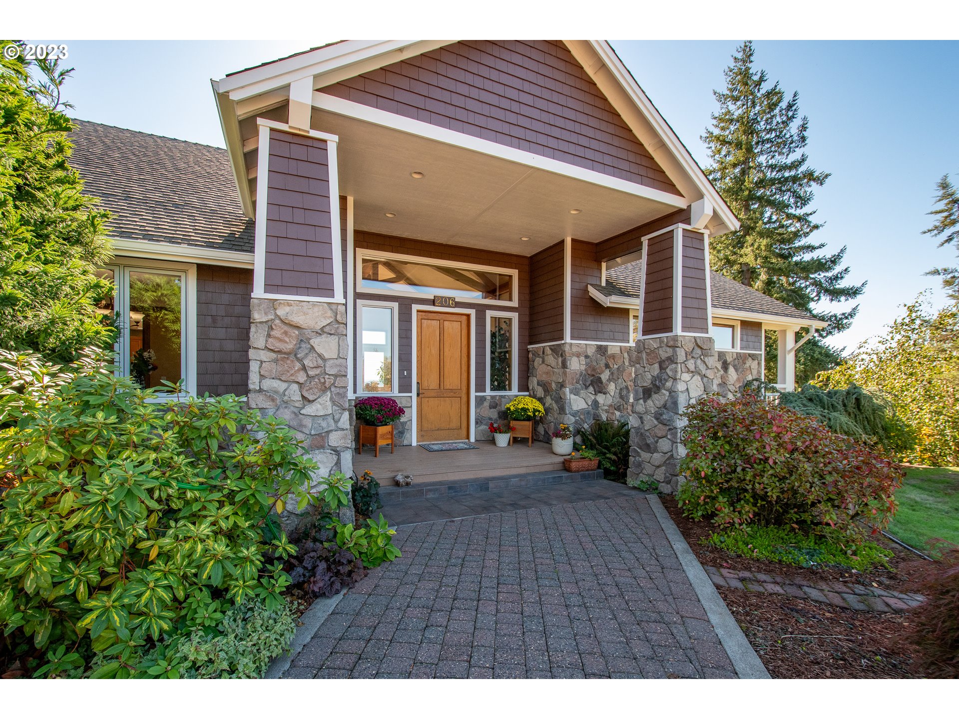 206 Pebble Lane Kalama, WA 98625 - Photo 3 of 47 a front view of a house with a yard and potted plants