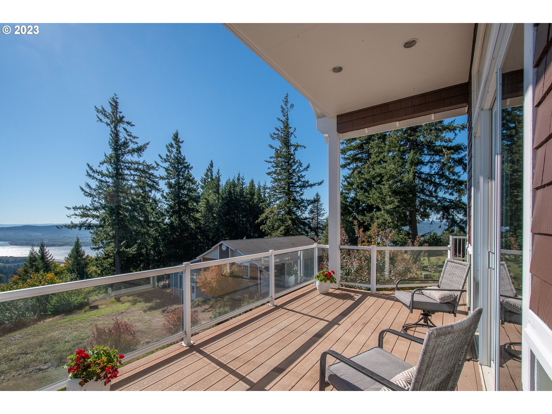 206 Pebble Lane Kalama, WA 98625 - Photo 38 of 47 a view of a balcony with floor to ceiling windows and wooden fence