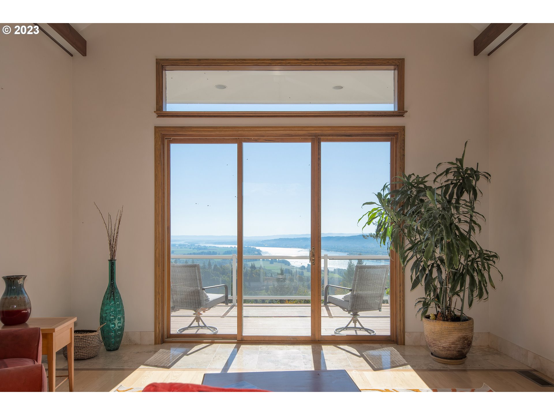 206 Pebble Lane Kalama, WA 98625 - Photo 8 of 47 a living room with a floor to ceiling window and potted plant