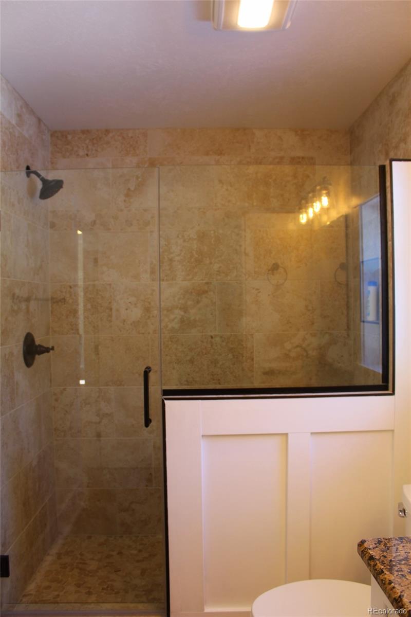 4147 Campfire Road Hartsel, CO 80449 - Photo 17 of 27 a bathroom with a shower and a toilet