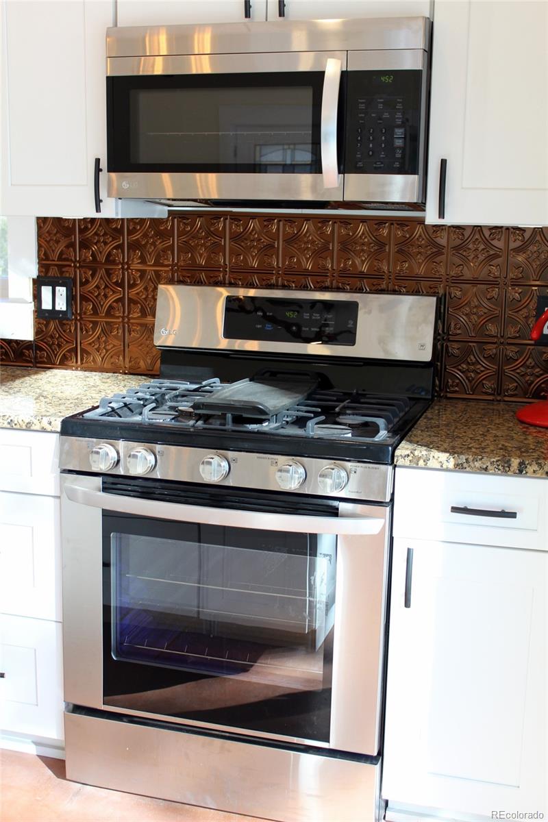 4147 Campfire Road Hartsel, CO 80449 - Photo 9 of 27 a stove top oven sitting inside of a kitchen