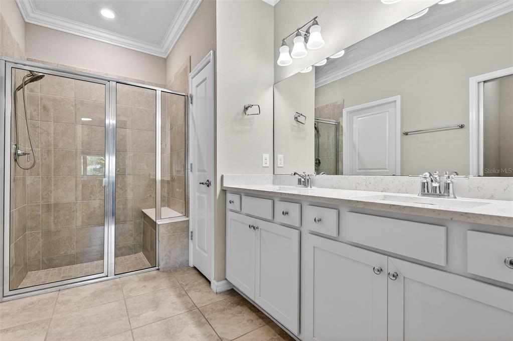 6427 Mooring Line Circle Apollo Beach, FL 33572 - Photo 30 of 34 a spacious bathroom with a shower sink and mirror