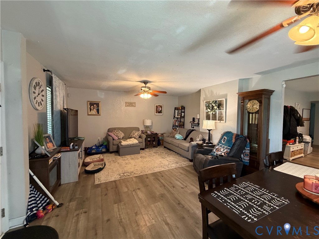1124 Myrtle Street Suffolk, VA 23434 - Photo 2 of 15 Open-concept living area featuring wood-finish flo