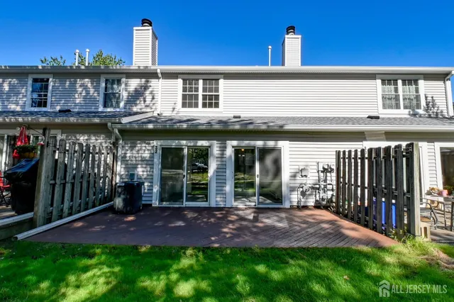 a view of a house with backyard and porch