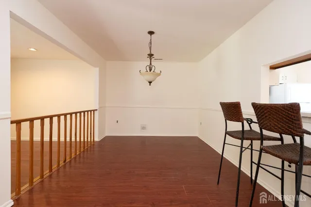 a view of a hallway with chairs