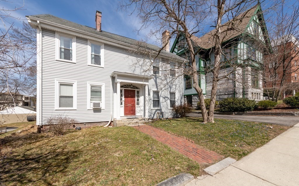36 Cedar Street, Unit 1A Worcester, MA 01609 - Photo 2 of 19 a front view of a house with a yard