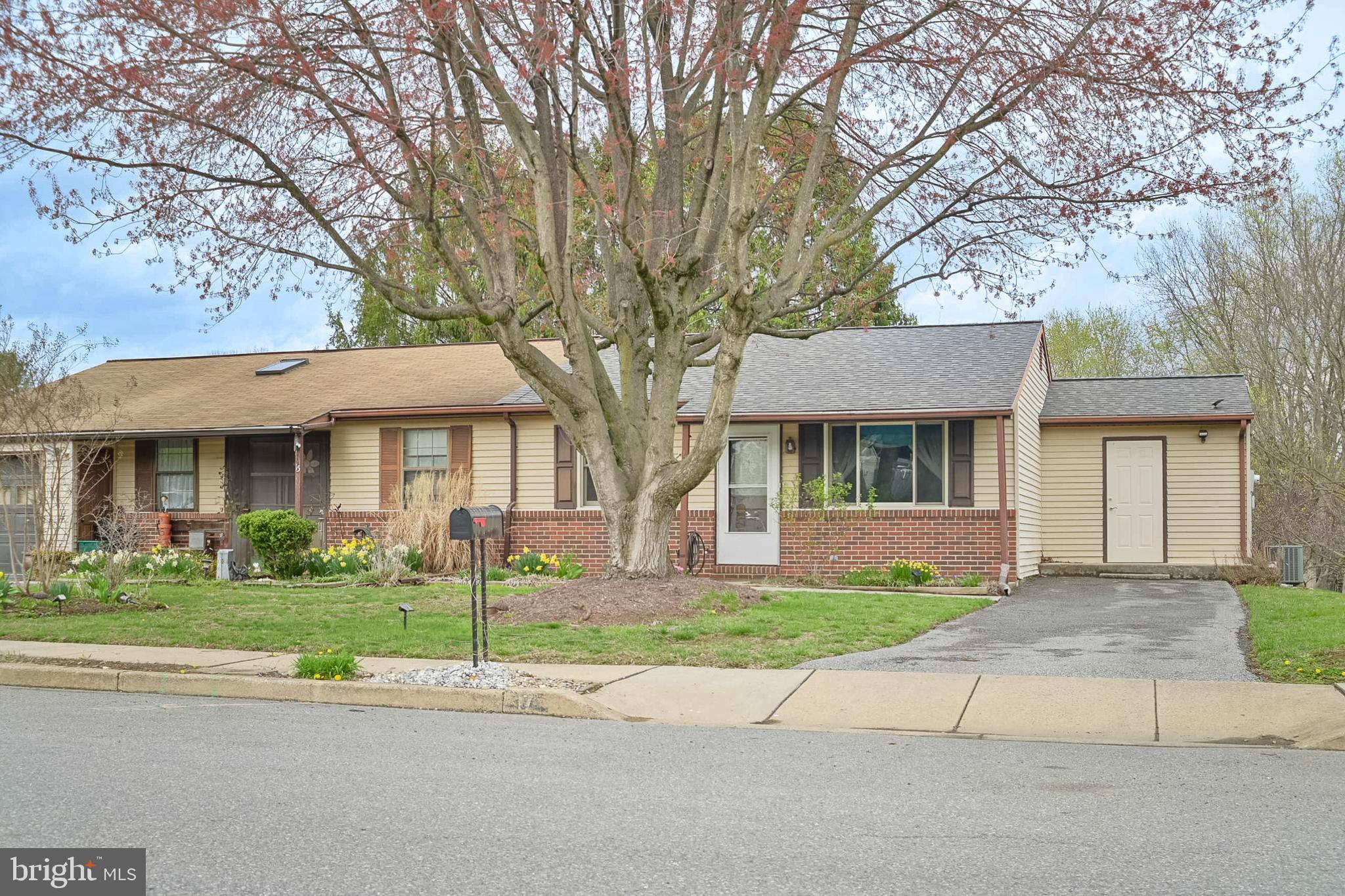 17 Turnbridge Drive Lancaster, PA 17603 - Photo 25 of 32 a front view of a house with a yard and potted plants